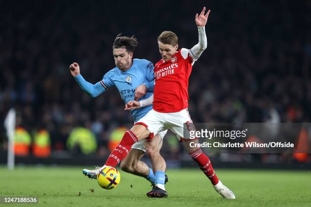 Jack Grealish of Manchester City and Martin Odegaard of Arsenal during the Premier League match between Arsenal FC and Manchester City at Emirates...