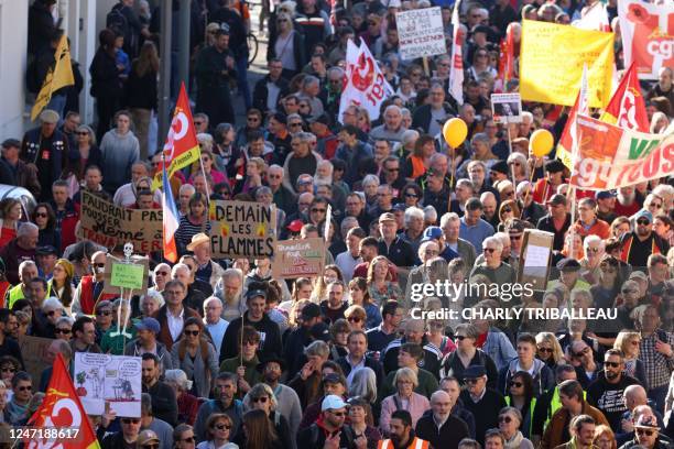 People take part in a demonstration on the fifth day of nationwide rallies organised since the start of the year, against a deeply unpopular pensions...