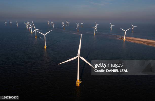 An aerial view shows wind turbines at RWE's Scroby Sands Wind Farm, off the coast of Great Yarmouth, eastern England, on February 15, 2023.