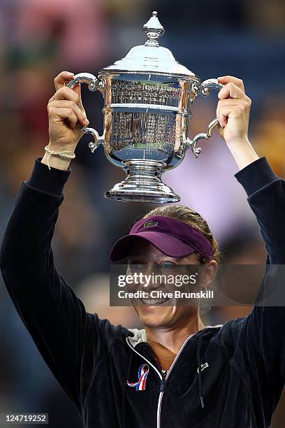 Samantha Stosur of Australia celebrates with the championship trophy after defeating Serena Williams of the United States to win the Women's Singles...