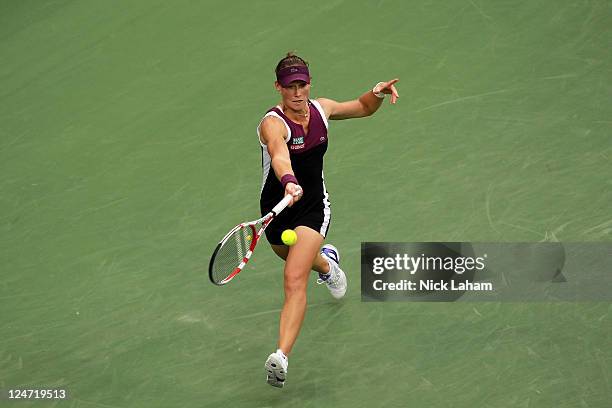 Samantha Stosur of Australia returns a shot against Serena Williams of the United States during the Women's Singles Final on Day Fourteen of the 2011...