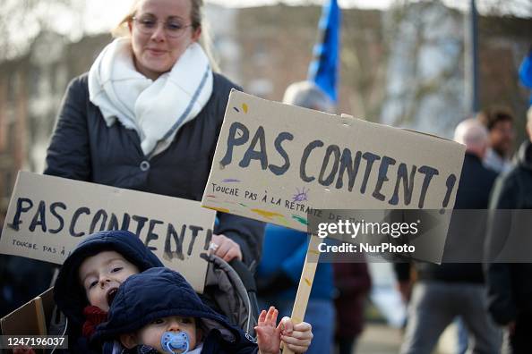 Protesting Babies A woman is protesting with two babies with placards reading 'Unhappy ...