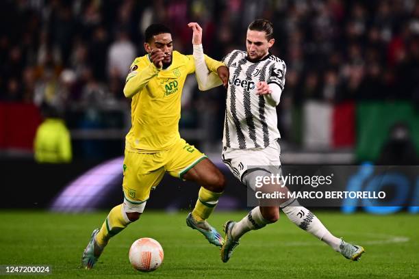 Nantes' Cameroon's defender Jean-Charles Castelletto and Juventus' French midfielder Adrien Rabiot go for the ball during the UEFA Europa League...