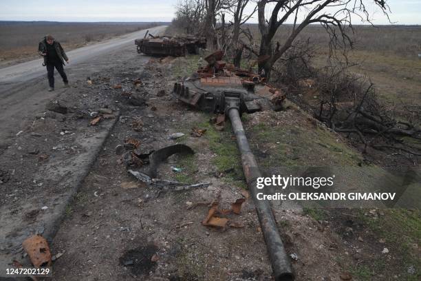 This photograph taken on February 16 shows a destroyed Russian tank on a road near village of Davydiv Brid, Kherson region, southern Ukraine, amid...