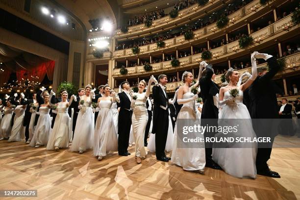 Members of the Young Ladies and Young Gentlemen Committee dance during the opening of the annual Vienna Opera Ball at the Vienna State Opera in...