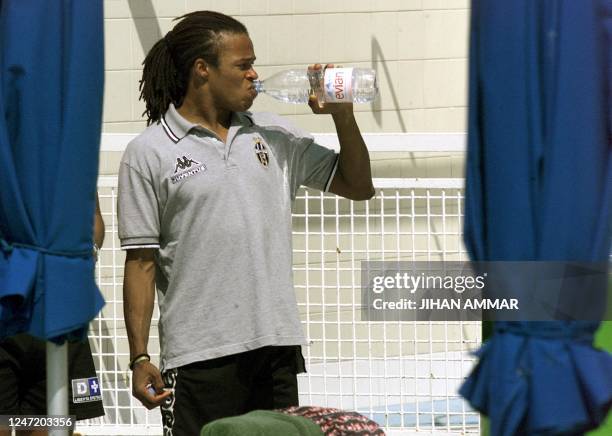 Juventus midfielder Edgar Davids, who also plays for the Dutch national side, cools off by a hotel pool in Nicosia 16 September 1999, hours before...