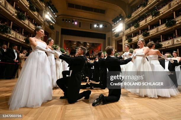 Members of the Young Ladies and Young Gentlemen Committee dance during the opening of the annual Vienna Opera Ball at the Vienna State Opera in...