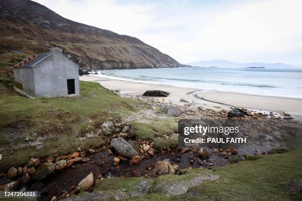 Photograph taken on January 31, 2023 shows the fisherman's cottage used in the film "The Banshees of Inisherin", on Keem beach, on the Achill Island,...