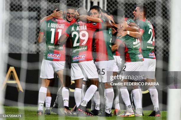 Boston River's midfielder Jonathan Urretaviscaya celebrates with his teammates after scoring his team's first goal during the Copa Libertadores stage...