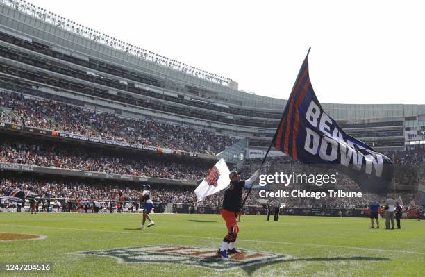 Chicago Bears fans celebrate a touchdown reception by wide receiver Allen Robinson in the first quarter against the Cincinnati Bengals at Soldier...