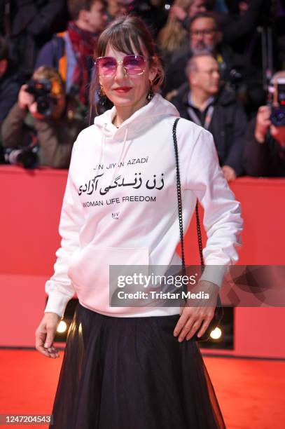 Meret Becker attends the "She Came to Me" premiere and opening ceremony red carpet during the 73rd Berlinale International Film Festival Berlin at...