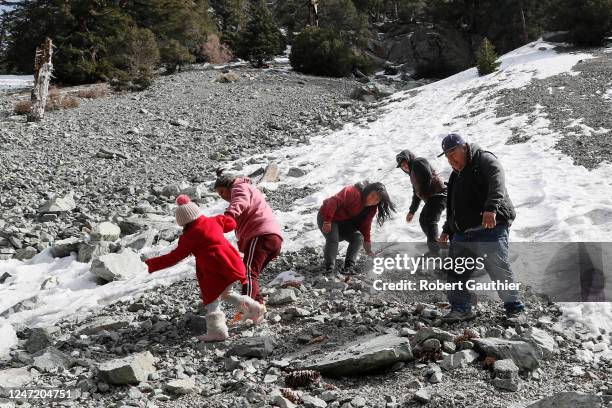 Mt. Baldy, CA, Thursday, February 16, 2023 - The Martinez Morales family frolic on a snowy roadside near Mt. Baldy. Right to left are Marco, Marco...