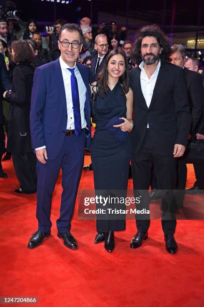 Cem Oezdemir, his wife Pia Maria Castro and Numan Acar attend the "She Came to Me" premiere and opening ceremony red carpet during the 73rd Berlinale...