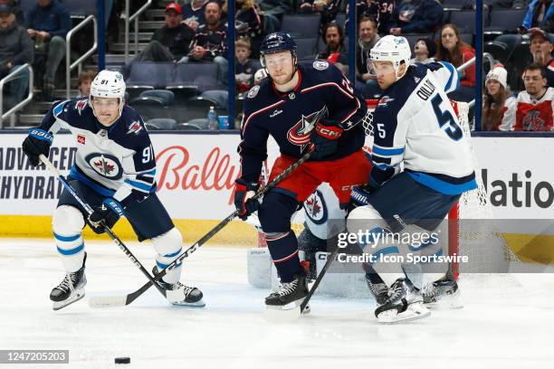 Columbus Blue Jackets right wing Mathieu Olivier follows the puck in front of the Winnipeg Jets goal during the first period in a game on February 16...