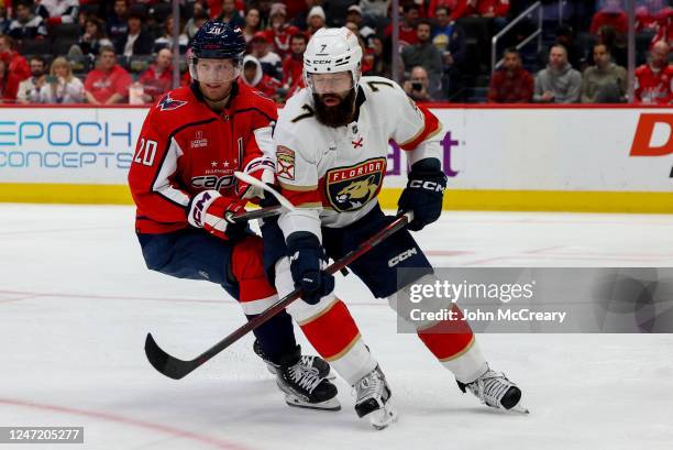 Lars Eller of the Washington Capitals and Radko Gudas of the Florida Panthers battle for position during a game at Capital One Arena on February 16,...