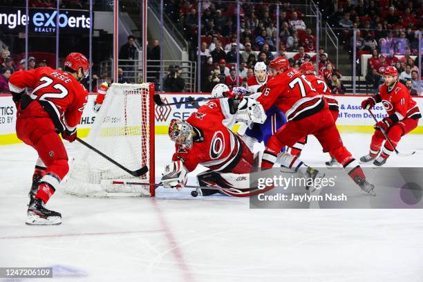 Antti Raanta of the Carolina Hurricanes blocks the puck during the first period of the game against the Montreal Canadiens at PNC Arena on February...