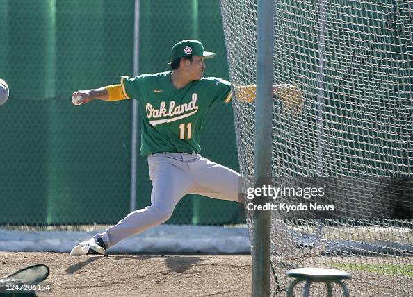 Oakland Athletics right-handed pitcher Shintaro Fujinami throws his ...