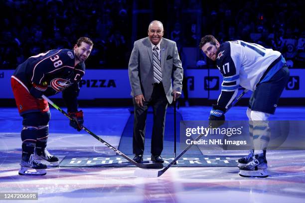 Alton White participates in a ceremonial puck drop prior to a game between the Columbus Blue Jackets and the Winnipeg Jets at Nationwide Arena on...