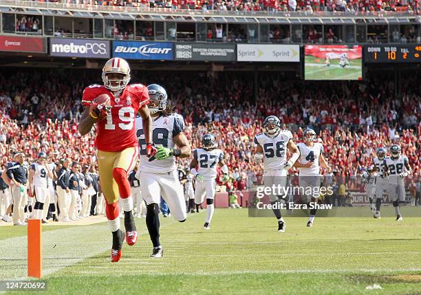 Ted Ginn of the San Francisco 49ers outruns Earl Thomas and the rest of the Seattle Seahawks on his way to scoring a touchdown on a kickoff return...