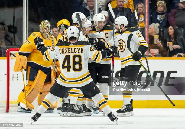 Craig Smith of the Boston Bruins celebrates his goal with teammates against the Nashville Predators during an NHL game at Bridgestone Arena on...