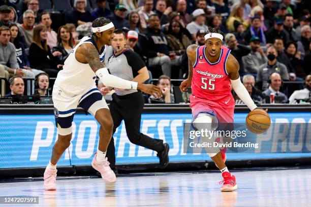 Delon Wright of the Washington Wizards drives to the basket while Jaden McDaniels of the Minnesota Timberwolves defends in the third quarter of the...