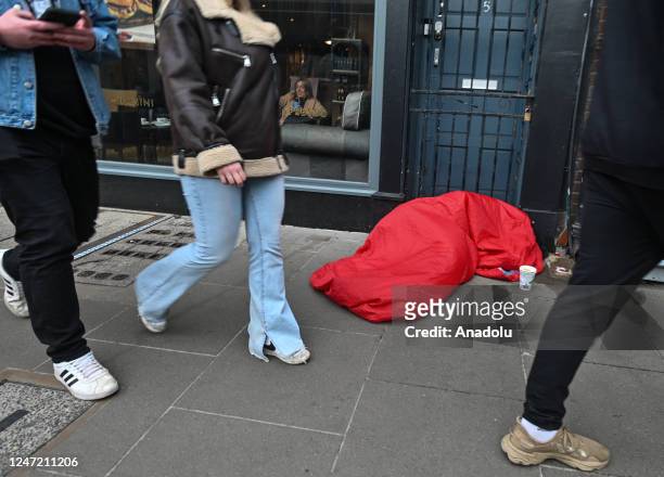 Person in a sleeping bag is sleeping on the pavement in Dublin city center, Ireland on February 16, 2023. As per the latest report, rents in Ireland...