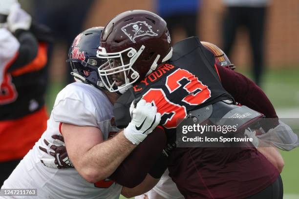 American defensive lineman Cameron Young of Mississippi State wears the Pirate flag helmet in memory of late head coach Mike Leach during Wednesdays...