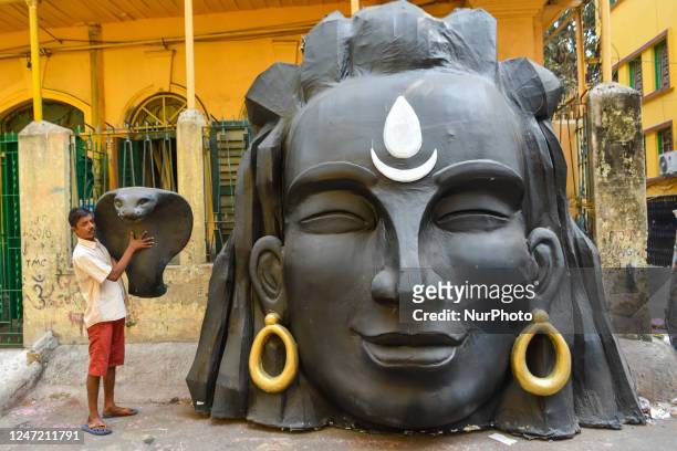 Styrofoam head of Lord Shiva and his snake is seen at a artisan workshop which is made for decoration purpose on the occasion of Maha Shivratri in...
