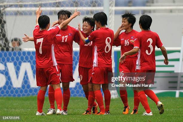 North Korea players celebrate first goal by Choe Mi Gyong during the London Olympic Women's Football Asian Qualifier match between North Korea and...