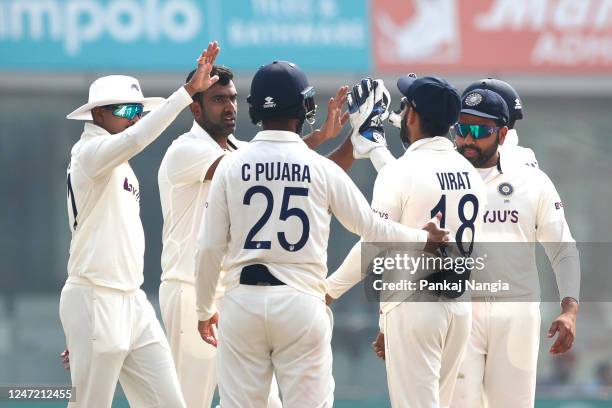 Ravichandran Ashwin of India celebrates the wicket of Alex Carey of Australia during day one of the Second Test match in the series between India and...