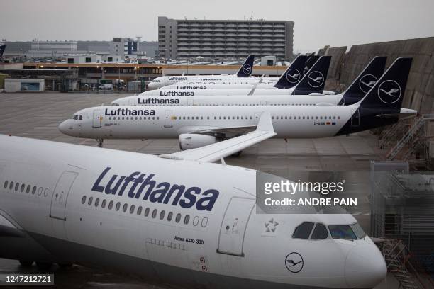 Planes of German airline Lufthansa are seen parked during a strike at Frankfurt Airport in Frankfurt am Main, western Germany, on February 17, 2023....