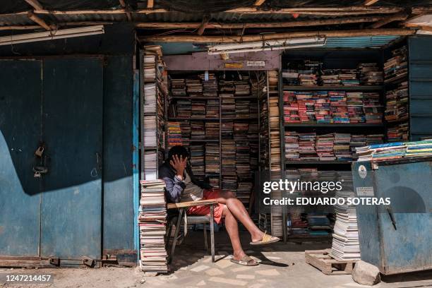 Man rest in a street stall in the city of Addis Ababa, Ethiopia, as the city prepares to host the 36th Ordinary Session of the Assembly of the AU, on...