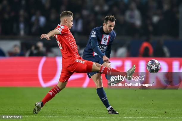 Joshua Kimmich of Bayern Muenchen and Fabian Ruiz of Paris Saint-Germain battle for the ball during the UEFA Champions League round of 16 leg one...