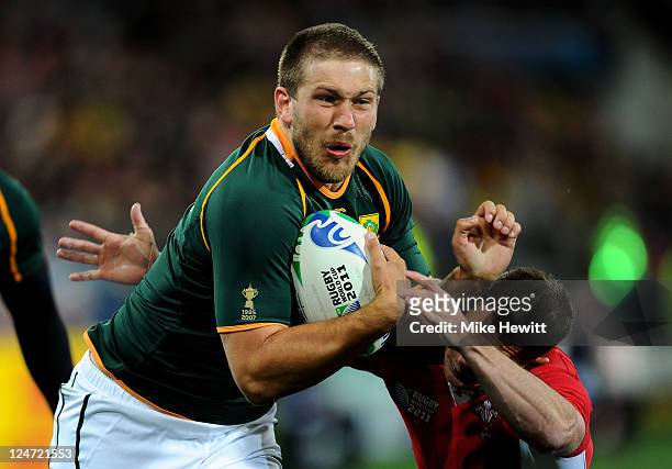 Francois Steyn of South Africa powers through the tackle from Shane Williams of Wales on his way to scoring the opening try during the IRB 2011 Rugby...