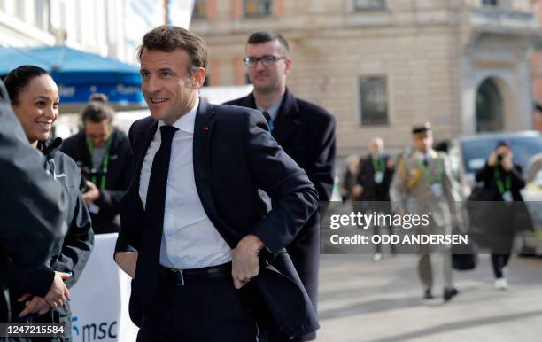 French President Emmanuel Macron arrives in front of the Bayerischer Hof hotel, venue of the Munich Security Conference in Munich, southern Germany,...