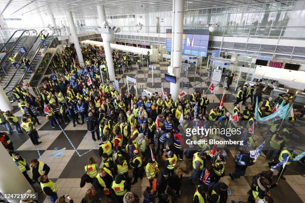 Ground services employees protest march through the airport while during strike action at Munich International Airport in Munich, Germany, on Friday,...