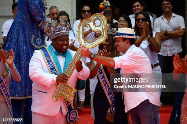 King Momo Djeferson Mendes da Silva receives the keys to the city of Rio from Rios Mayor Eduardo Paes , during the official carnival opening ceremony...