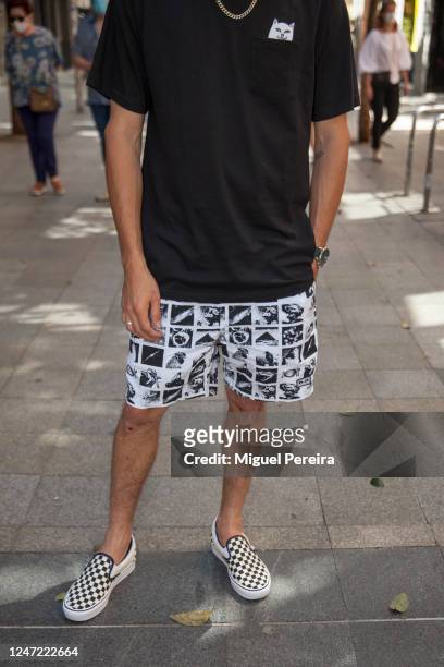 Eugenio wears Vans Ultracush sneakers and socks, Obey shorts, Ripndip T-shirt, and Primark watch during Phase 1 of reopening from the COVID-19...