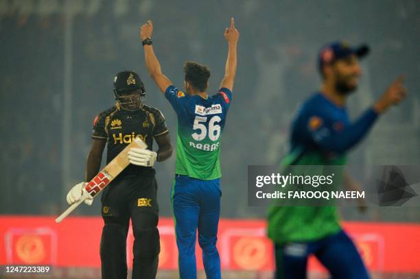 Multan Sultans' Abbas Afridi celebrates the wicket of Peshawar Zalmi's Rovman Powell as he is walking back during the Pakistan Super League Twenty20...