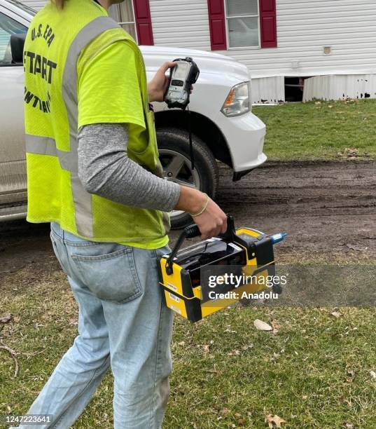 Measurement tools are seen as officials inspect the area after the train derailment in East Palestine, Ohio, United States on February 17, 2023. The...