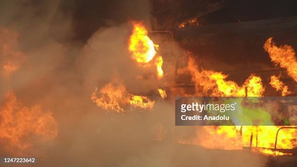 Smoke and flames rise after after the train derailment in East Palestine, Ohio, United States on February 17, 2023. The train derailment happened on...