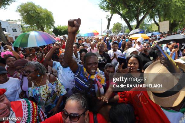 People protest against government economic policies in Paramaribo, on February 17, 2023. - Hundreds of people protested in Suriname Friday against...