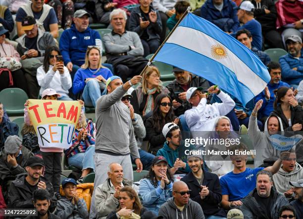 Fans cf Argentina cheer with a national flag in the Quarter Finals singles match between Cameron Norrie of Great Britain and Tomas Etcheverry of...