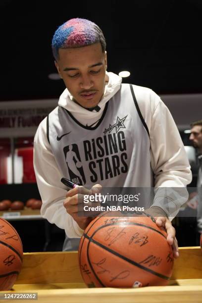 Jeremy Sochan of the San Antonio Spurs autographs official Wilson basketballs before Rising Stars Practice as part of 2023 NBA All Star Weekend on...