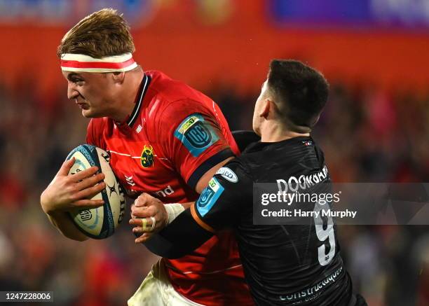 Limerick , Ireland - 17 February 2023; Gavin Coombes of Munster is tackled by Reuben Morgan-Williams of Ospreys during the United Rugby Championship...