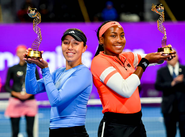 Coco Gauff and Jessica Pegula of United States pose with their trophy after winning the doubles final match against Lyudmyla Kichenok of Ukraine and...