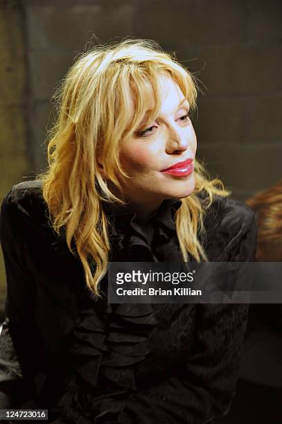 Courtney Love attends the Edun Spring 2012 fashion show during Mercedes-Benz Fashion Week at 330 West Street on September 11, 2011 in New York City.