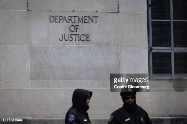 Signage outside the US Department of Justice headquarters in Washington, DC, US, on Friday, Feb. 17, 2023. The Justice Department is shifting its...