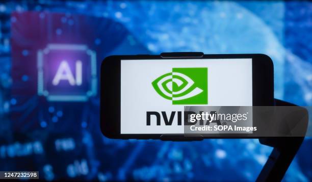 In this photo illustration, the logo of NVIDIA is seen displayed on a mobile phone screen with AI written in the background.