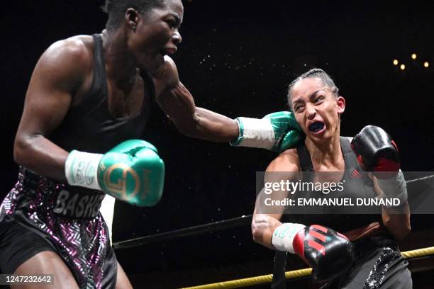 France's Estelle Mossely competes against Malawi's Anisha Basheel during their women's International Boxing Organisation lightweight title fight at...